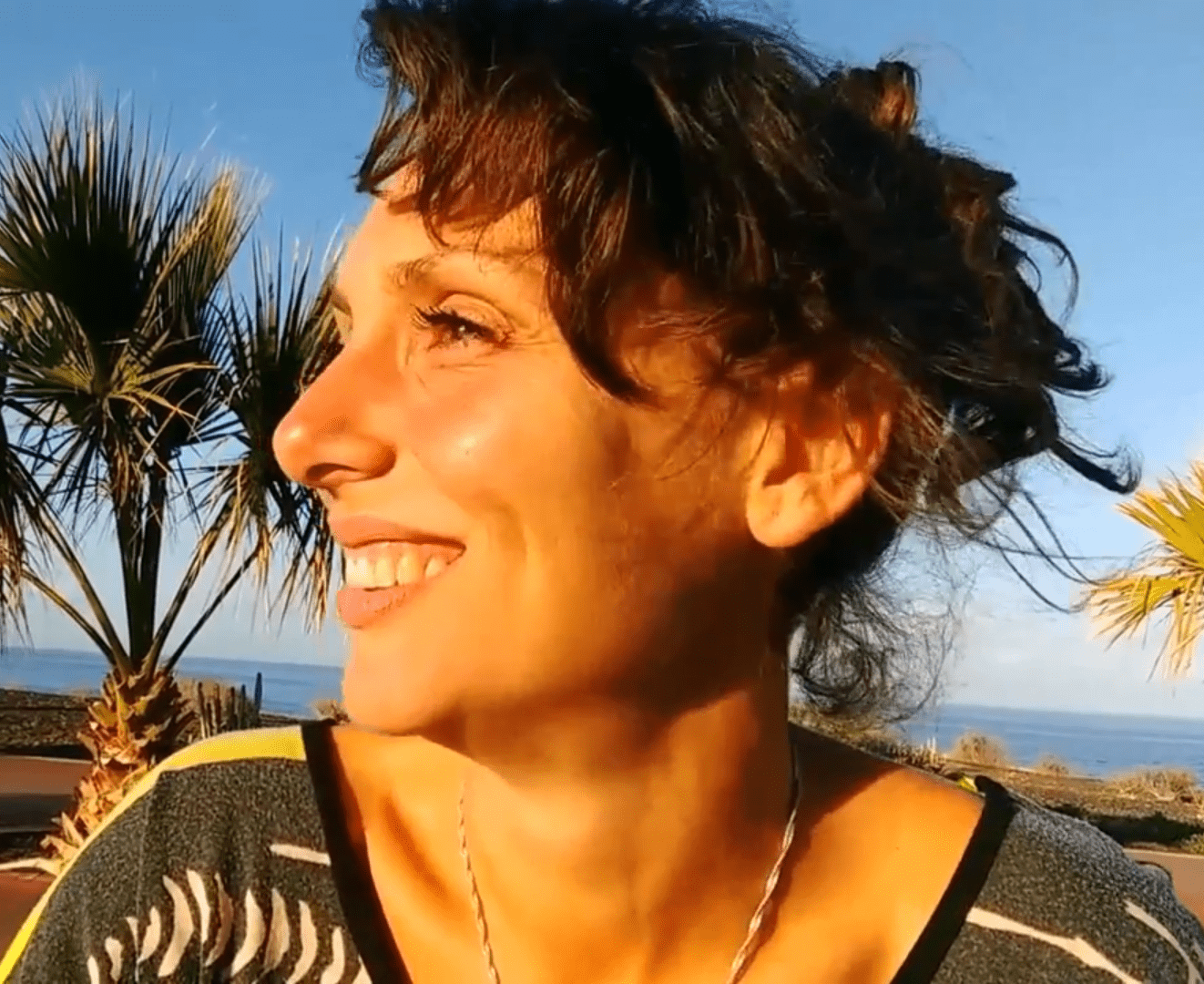 Smiling woman looking to the side – Founder of Smart & Scaled business automation service